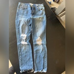 Distressed blue jeans